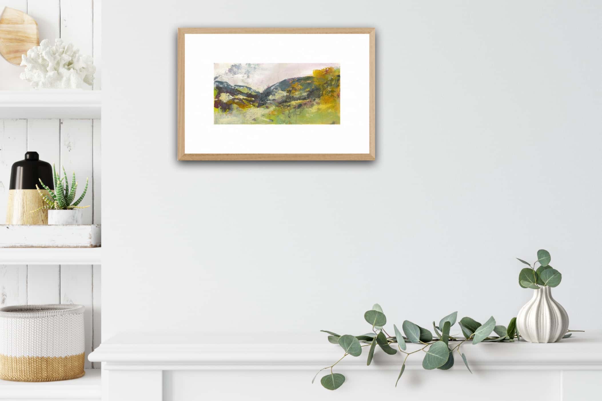 An acrylic painting of the hill trails in Wales on a White wall