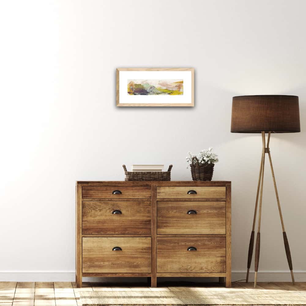 Abstract landscape titled A Primitive World - above a wooden chest of drawers