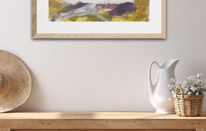 Home decor - an abstract landscape above a wooden chest.