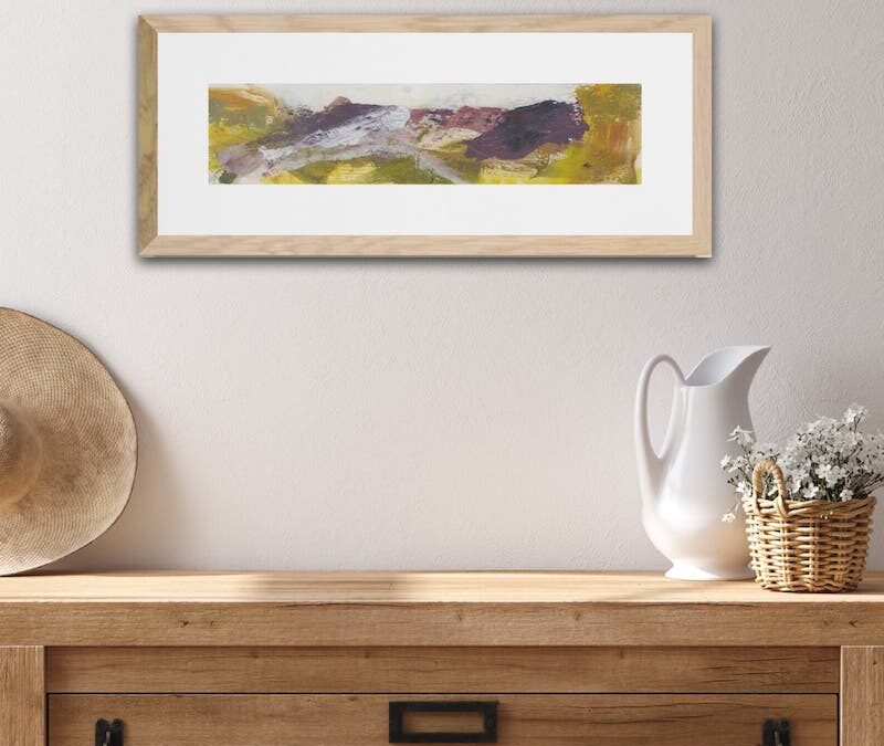 Home decor - an abstract landscape above a wooden chest.